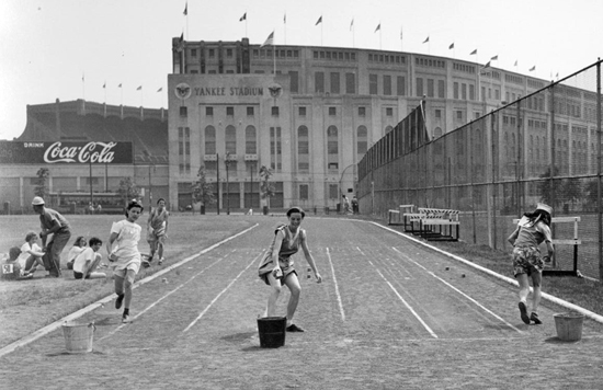 Image of Girls race at McCombs Dam Park, in front of Yankee Stadium, on February 10, 1947.  Neg. 24977
